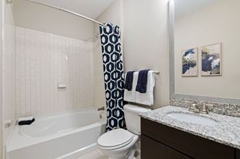 Curved shower rods and framed mirrors